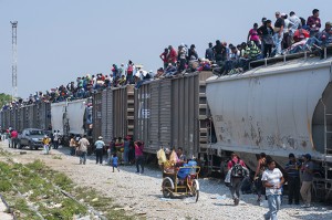 Migrants heading to the United States often ride atop "The Beast", a notorious cargo train that runs through Mexico.  /Keith Dannemiller/International Organization for Migration