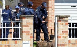 Forensic experts investigating an Islamic State terrorism threat collect evidence from a house in the Guildford area of Sydney, Australia on Sept. 18.