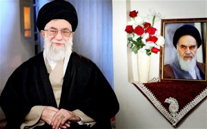Ayatollah Ali Khamenei with portrait of Ayatollah Khomeini. / AFP