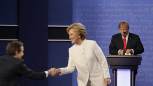 Donald Trump at his podium as Hillary Clinton congratulates moderator Chris Wallace following the third presidential debate. / AP