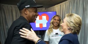 HIllary Clinton, right, with Jay Z, left, and Beyonce. 