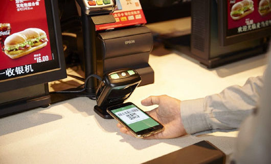 Brother, can you spare a mobile phone donation? Cash, credit cards go the way of dinosaurs in China