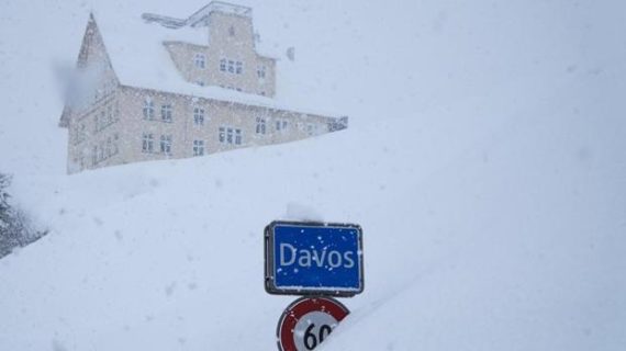 Global elites fly into Davos, risk snow drifts and avalanche threats to address global warming Global elites fly into Davos, risk snow drifts and avalanche threats to address global warming
