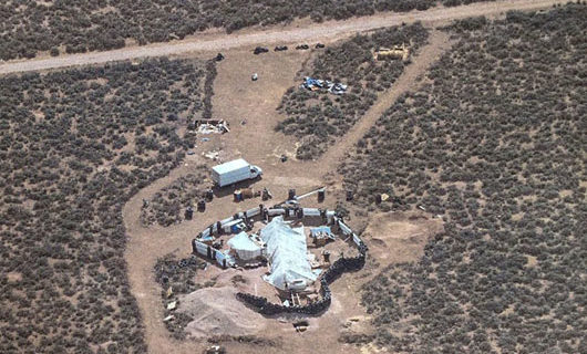 Son of notorious imam charged with training children at compound for school shootings