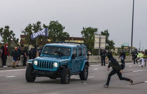 Rioters shoot comrades while aiming at car driving through mob
