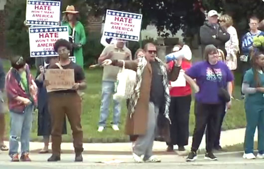 Trans activists protest outside Minneapolis Catholic school where children were murdered